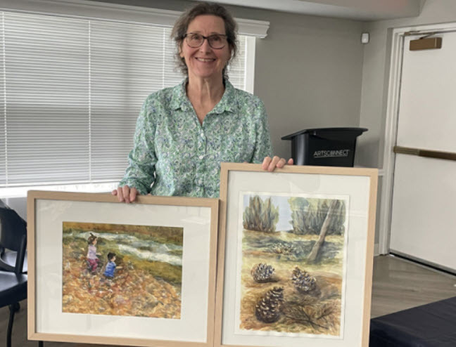 Sue Kinsella showing her paintings